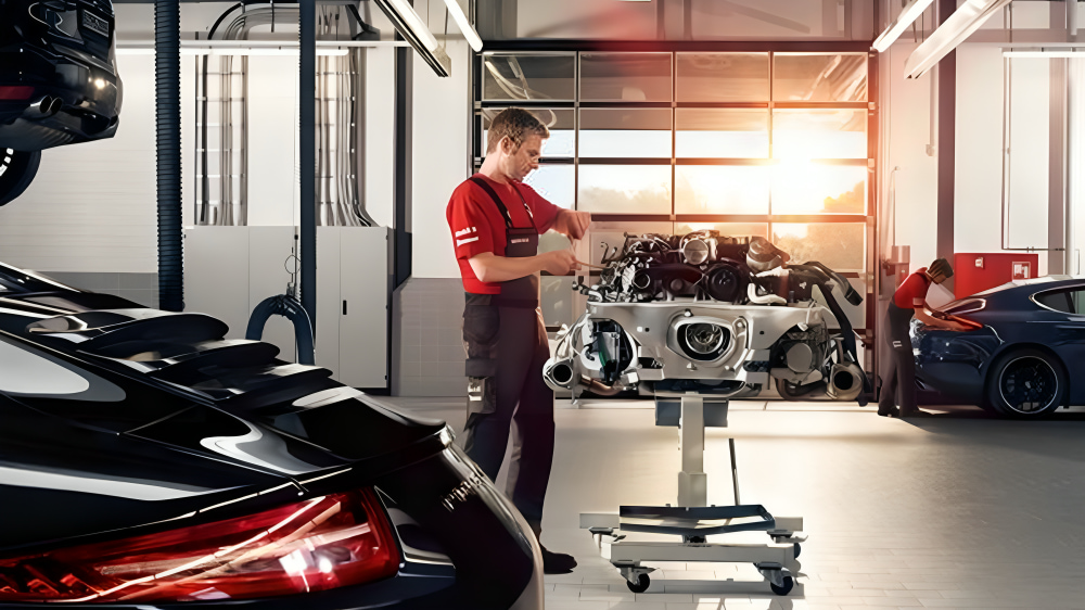 Technician assembling engine in performance workshop